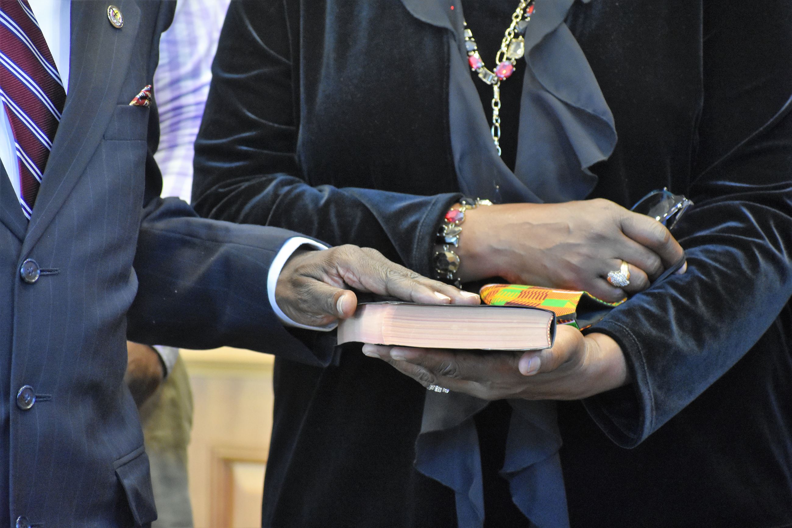Closeup of man's hand on a book