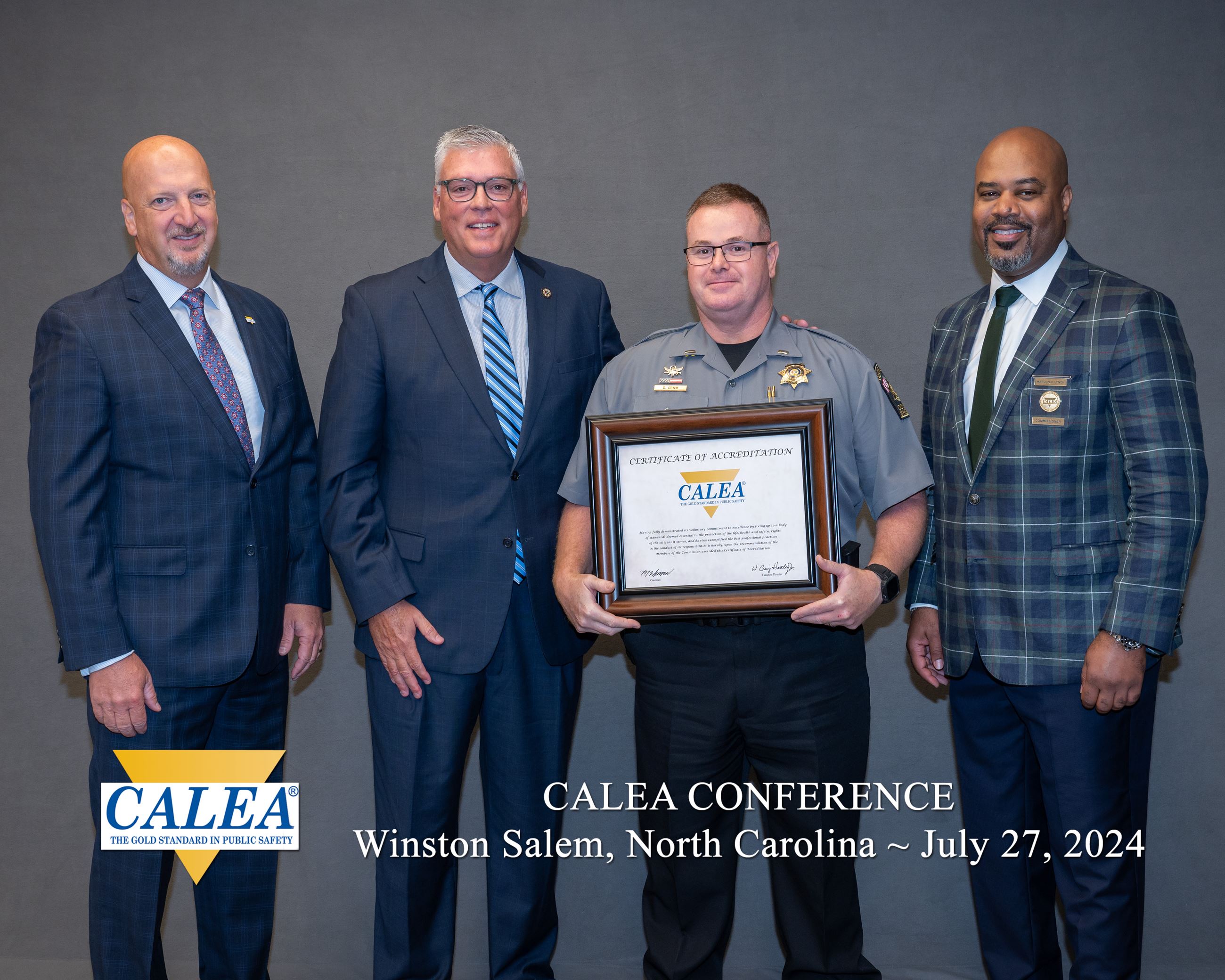 Sheriff Weaver and Lieutenant Chris Geno accept their accreditation plaque from CALEA 
